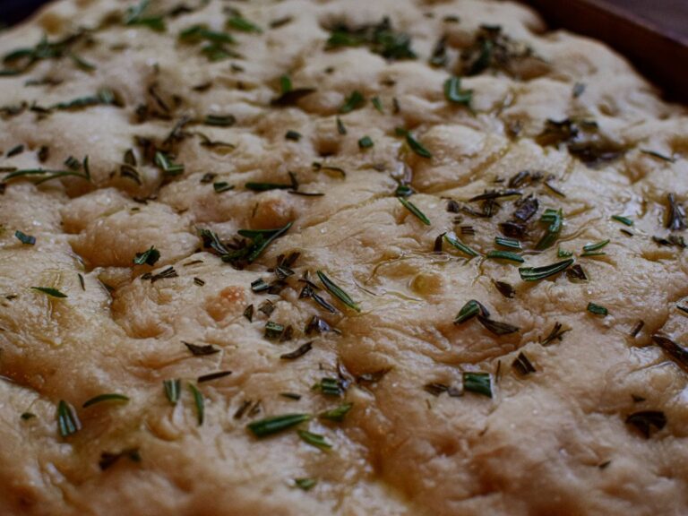 sourdough focaccia bread on a baking sheet