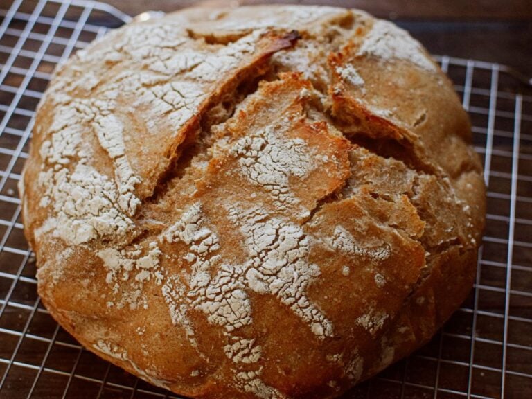 sourdough whole wheat bread on a cooling rack